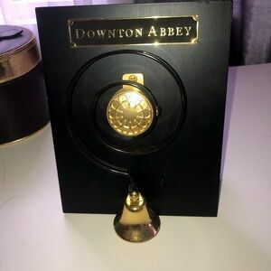 Gold Servants bell mounted on a Downtown Abbey sign. Downtown abbey fans!